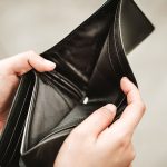 Hand open empty an wallet. Poor or personal financial problem concept.