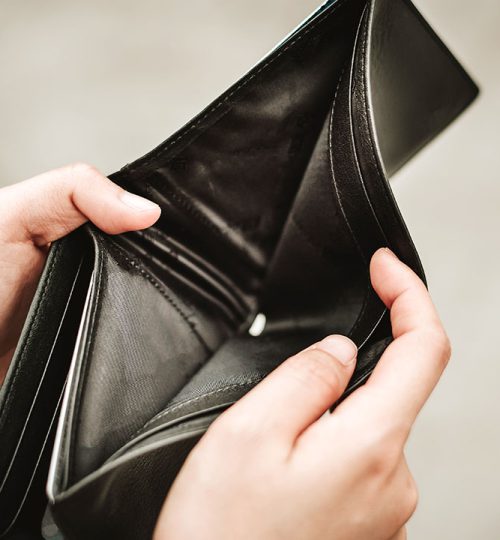 Hand open empty an wallet. Poor or personal financial problem concept.